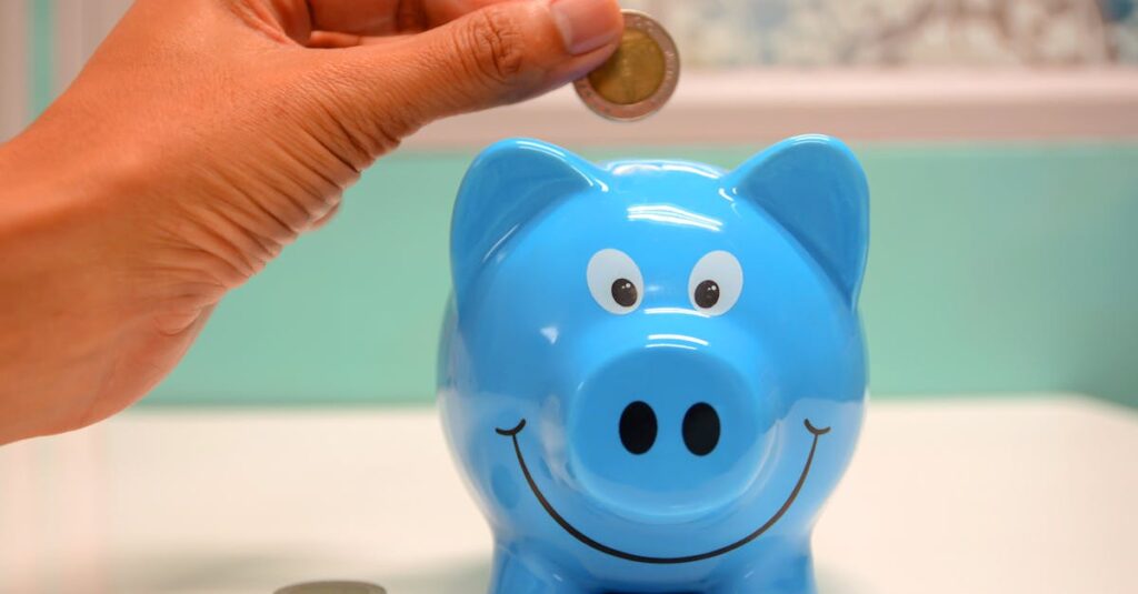 Hand inserting a coin into a blue piggy bank for savings and money management.